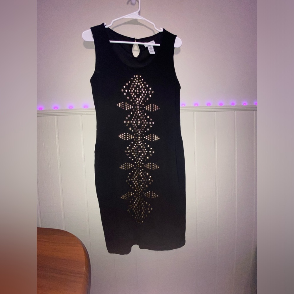 Black dress with gold sequins.